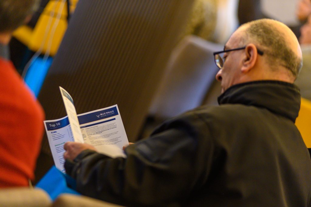 Attendee going through the Blue Whale Fact Sheet